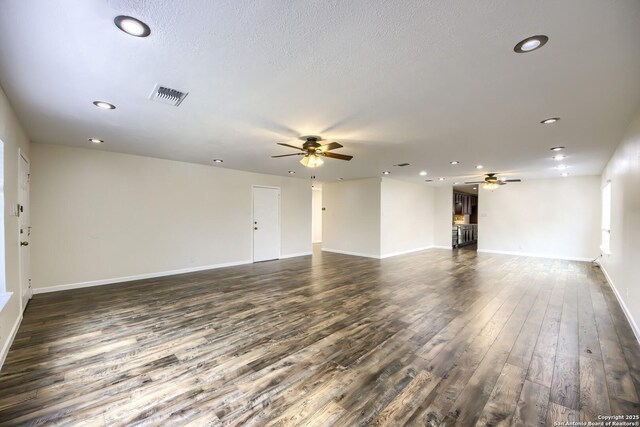 unfurnished living room featuring dark wood-type flooring, recessed lighting, and ceiling fan