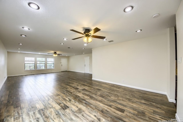 empty room featuring recessed lighting, baseboards, a ceiling fan, and dark wood-style floors