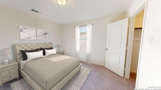 bedroom featuring visible vents, carpet, and baseboards