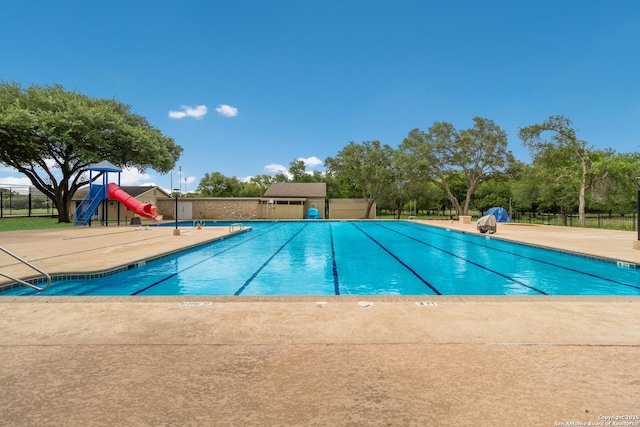 pool featuring a patio area and fence
