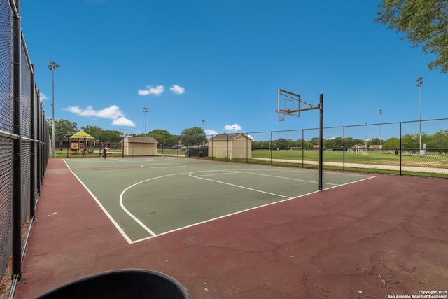 view of sport court featuring community basketball court and fence