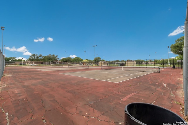 8706 Timber Ldg, San Antonio, TX 78250 - view of tennis court featuring fence