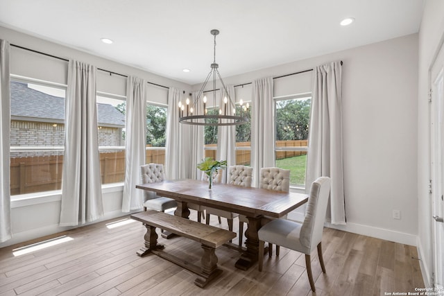 3818 Cualquiera, San Antonio, TX 78261 - dining room featuring healthy amount of natural light, a chandelier, baseboards, light wood-style floors, and recessed lighting