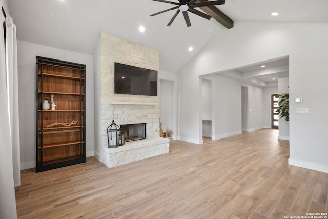 3818 Cualquiera, San Antonio, TX 78261 - unfurnished living room featuring a ceiling fan, light wood finished floors, a stone fireplace, baseboards, and recessed lighting