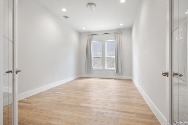 3818 Cualquiera, San Antonio, TX 78261 - empty room with light wood finished floors, recessed lighting, baseboards, and french doors