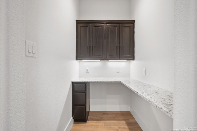 3818 Cualquiera, San Antonio, TX 78261 - unfurnished office with built in study area, light wood-style floors, and baseboards