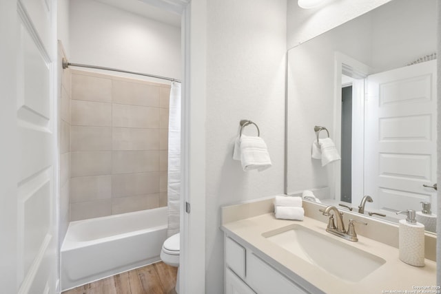 3818 Cualquiera, San Antonio, TX 78261 - bathroom with wood finished floors, toilet, vanity, and shower / bath combo