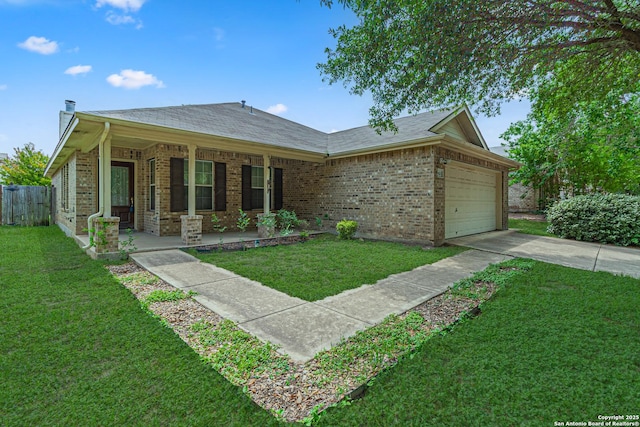 ranch-style home featuring a garage, covered porch, a front yard, brick siding, and concrete driveway