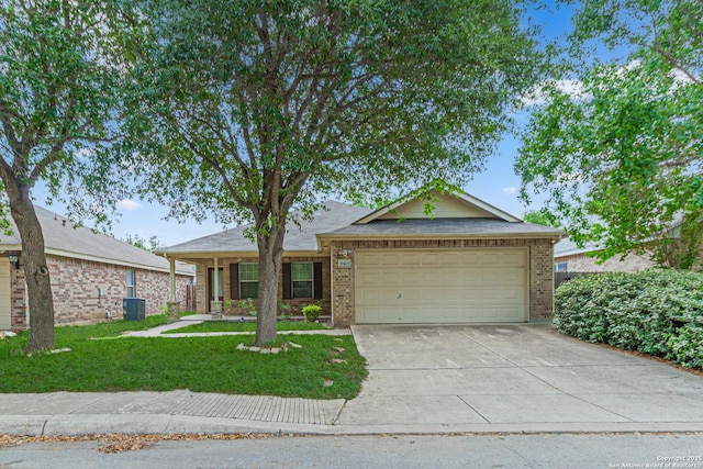 ranch-style house featuring driveway, a front yard, a garage, central air condition unit, and brick siding