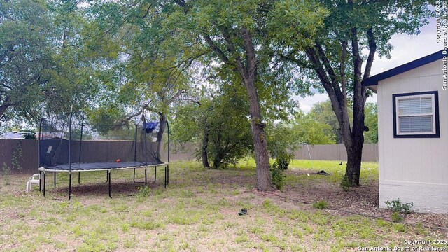 22902 Sweet Liberty, San Antonio, TX 78112 - view of yard with fence and a trampoline
