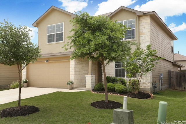 view of front of home with driveway, a front yard, a garage, fence, and stone siding