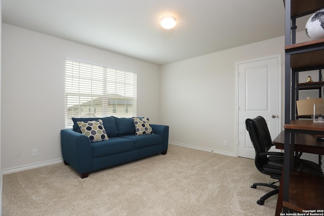 carpeted home office with baseboards