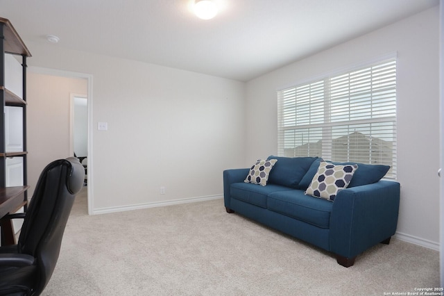 carpeted home office with baseboards