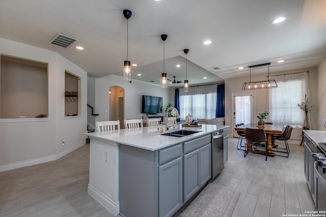 13911 Lazada, San Antonio, TX 78245 - kitchen with a sink, dishwasher, a kitchen island with sink, light wood-style flooring, and recessed lighting