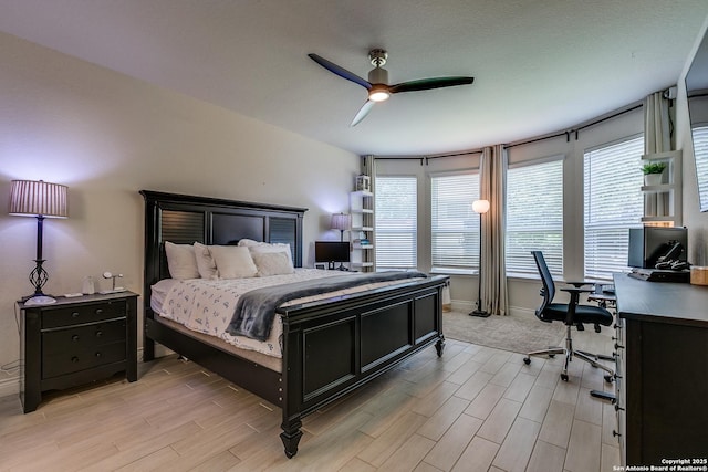 13911 Lazada, San Antonio, TX 78245 - bedroom featuring a desk, light wood-style floors, ceiling fan, and baseboards