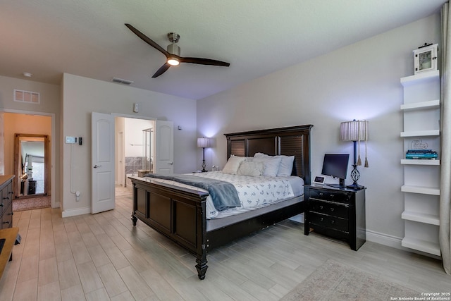 13911 Lazada, San Antonio, TX 78245 - bedroom featuring baseboards, light wood-style flooring, ensuite bathroom, and a ceiling fan