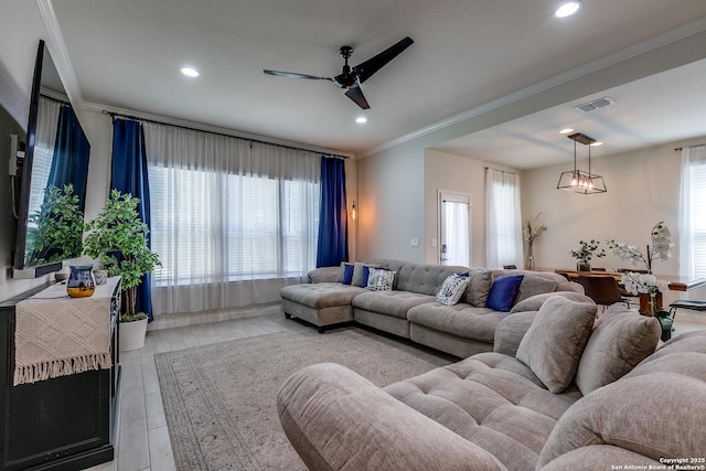 13911 Lazada, San Antonio, TX 78245 - living room with ornamental molding, a ceiling fan, and recessed lighting