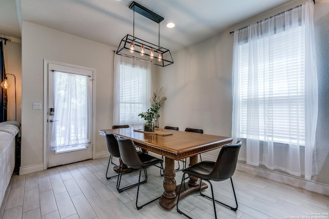 13911 Lazada, San Antonio, TX 78245 - dining space with a chandelier, light wood-type flooring, baseboards, and recessed lighting