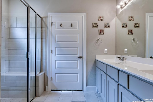 9407 Sundrop Vly, San Antonio, TX 78254 - bathroom featuring double vanity, tile patterned flooring, a shower stall, and a sink
