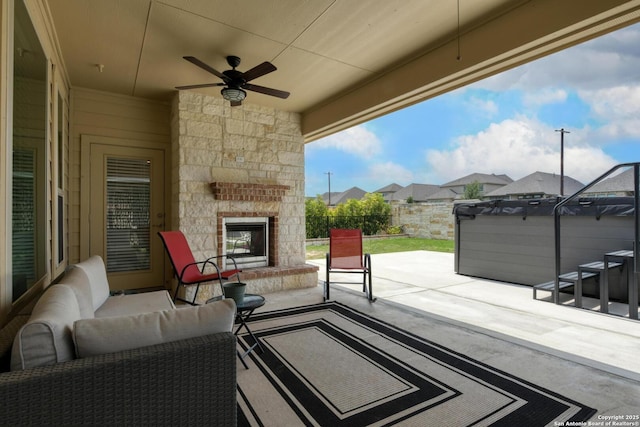 9407 Sundrop Vly, San Antonio, TX 78254 - view of patio / terrace with a residential view, an outdoor living space with a fireplace, a hot tub, ceiling fan, and a fenced backyard