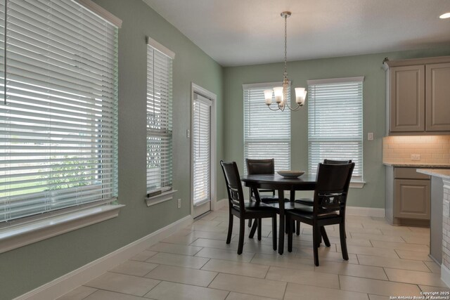 9407 Sundrop Vly, San Antonio, TX 78254 - dining area with an inviting chandelier, baseboards, and plenty of natural light