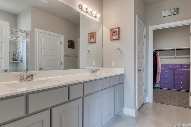 9407 Sundrop Vly, San Antonio, TX 78254 - bathroom with double vanity, baseboards, an enclosed shower, tile patterned floors, and a sink