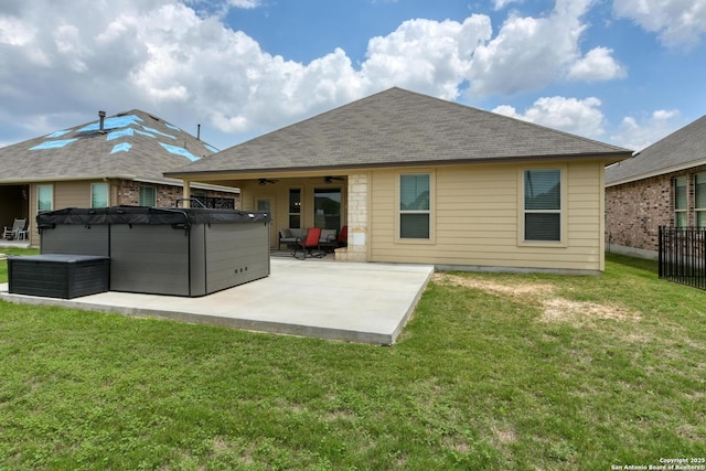 9407 Sundrop Vly, San Antonio, TX 78254 - rear view of house featuring a patio, a ceiling fan, a hot tub, and a yard
