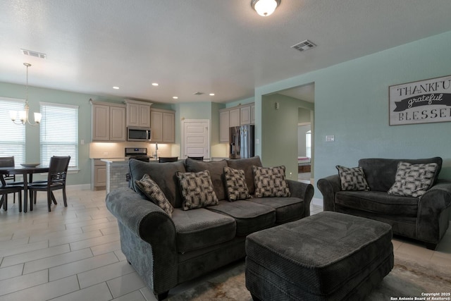 9407 Sundrop Vly, San Antonio, TX 78254 - living area featuring recessed lighting, visible vents, an inviting chandelier, and light tile patterned floors