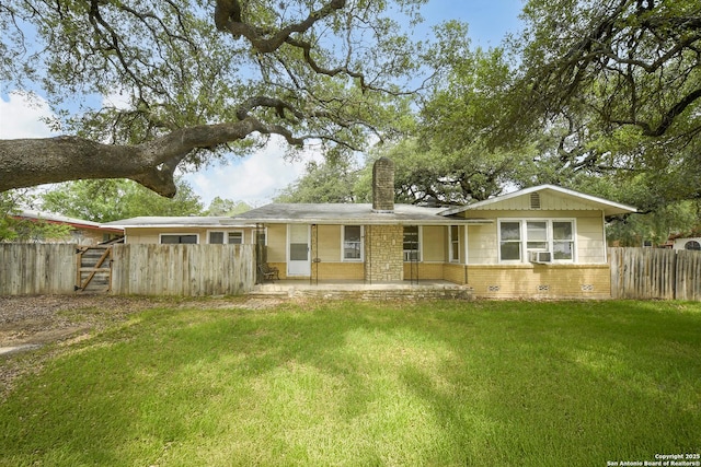 1304 Landa, New Braunfels, TX 78132 - view of front of house with fence, a front lawn, brick siding, a chimney, and cooling unit