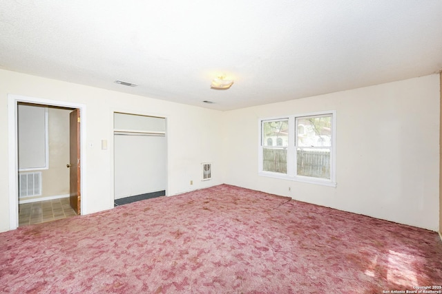 1304 Landa, New Braunfels, TX 78132 - unfurnished bedroom featuring carpet floors, a closet, and visible vents