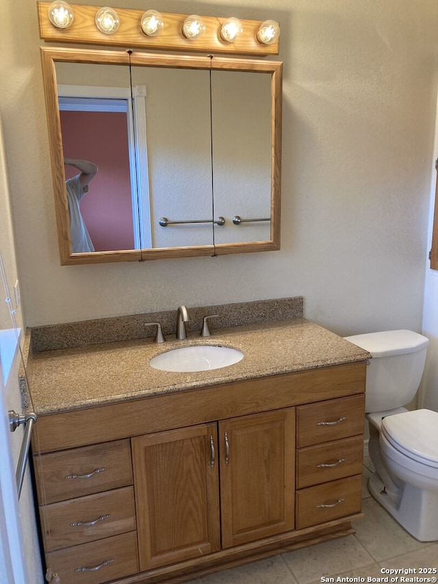 3014 War Knife, San Antonio, TX 78238 - half bath with toilet, tile patterned flooring, and vanity