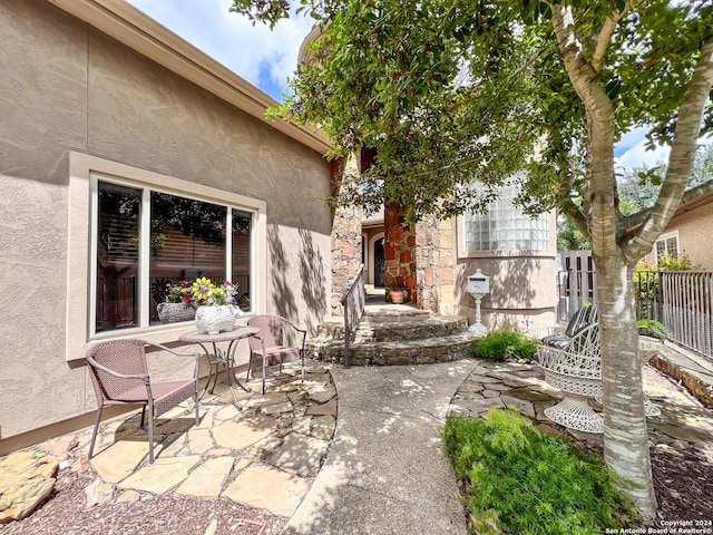 view of patio featuring fence