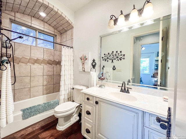 full bathroom featuring vanity, shower / bathtub combination with curtain, toilet, and wood finished floors