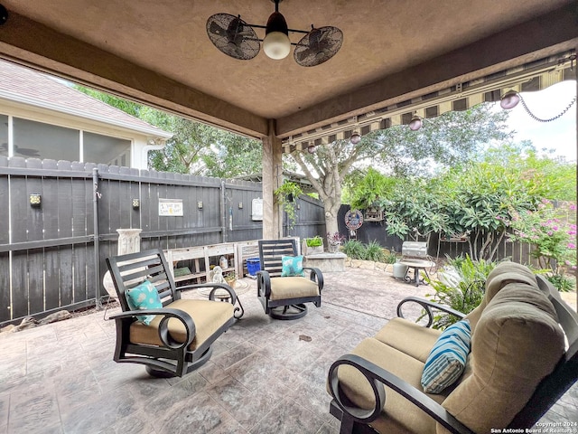 view of patio featuring ceiling fan and a fenced backyard