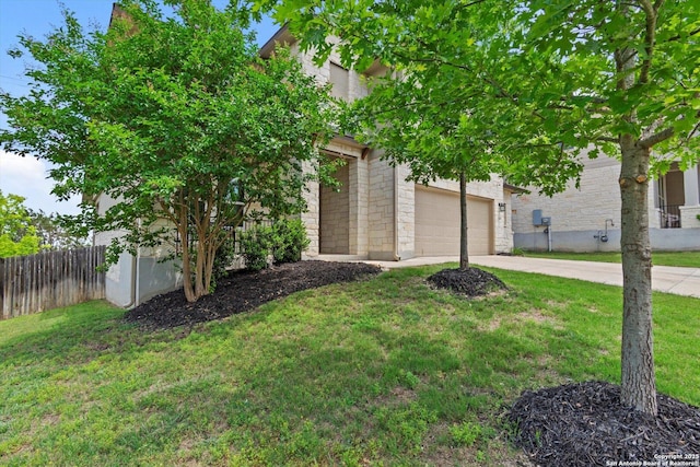 12819 Canadian, San Antonio, TX 78253 - obstructed view of property with a garage, fence, a front lawn, concrete driveway, and stone siding