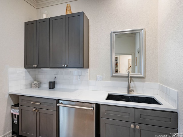 4 Waterford Gln, San Antonio, TX 78257 - kitchen with stainless steel dishwasher, a sink, light countertops, gray cabinets, and ornamental molding