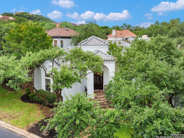 4 Waterford Gln, San Antonio, TX 78257 - mediterranean / spanish home with stucco siding, a tile roof, and a chimney