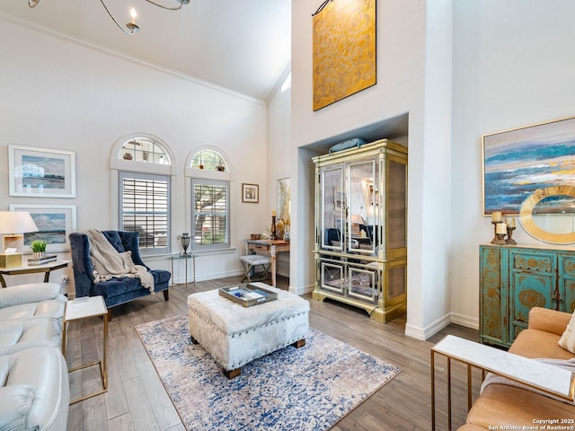 4 Waterford Gln, San Antonio, TX 78257 - living area featuring crown molding, high vaulted ceiling, light wood-style floors, and baseboards