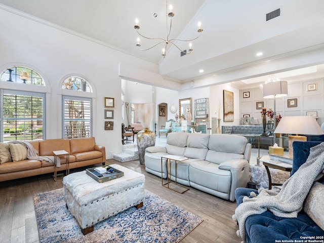 4 Waterford Gln, San Antonio, TX 78257 - living room featuring a chandelier, ornamental molding, high vaulted ceiling, wood-type flooring, and recessed lighting