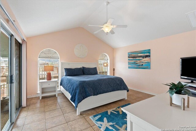 bedroom featuring a ceiling fan, light tile patterned floors, and lofted ceiling