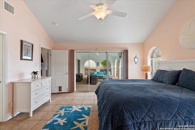 bedroom featuring visible vents, lofted ceiling, light tile patterned flooring, access to exterior, and ceiling fan