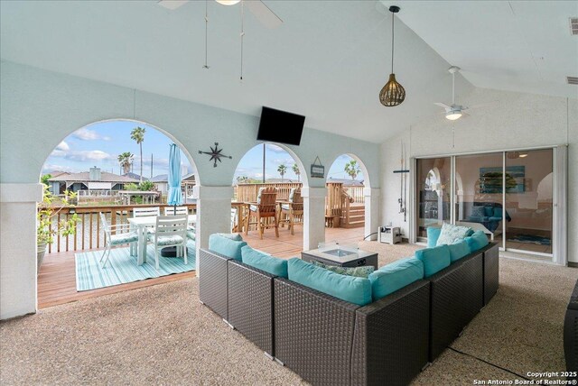 view of patio / terrace with an outdoor living space, a ceiling fan, outdoor dining space, and visible vents