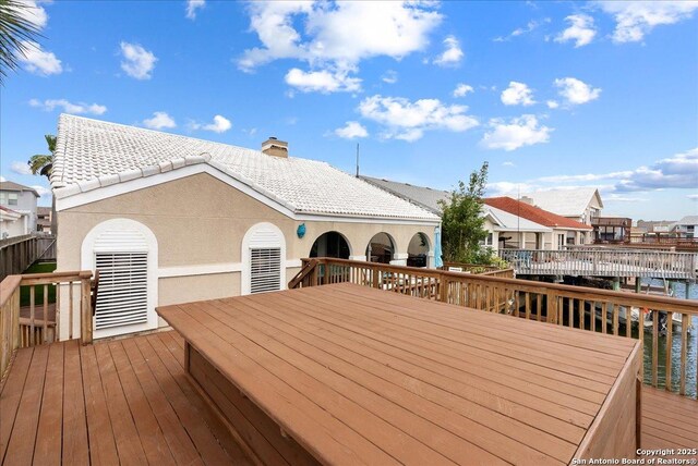 wooden terrace featuring a residential view