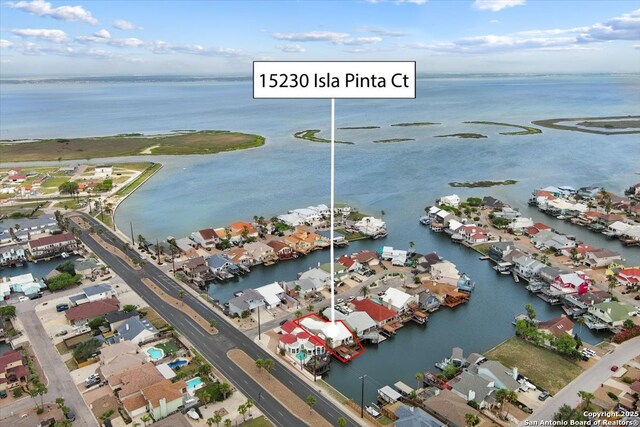 aerial view with a water view and a residential view