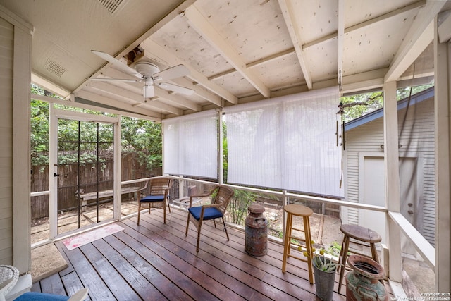 deck featuring ceiling fan and visible vents