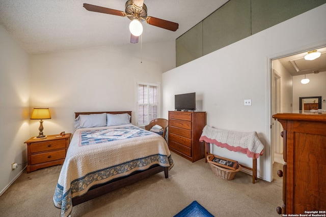 carpeted bedroom with ceiling fan, baseboards, attic access, and high vaulted ceiling