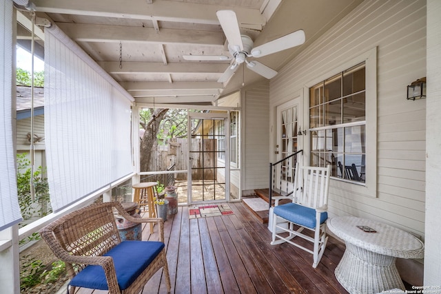 wooden terrace featuring french doors and a ceiling fan