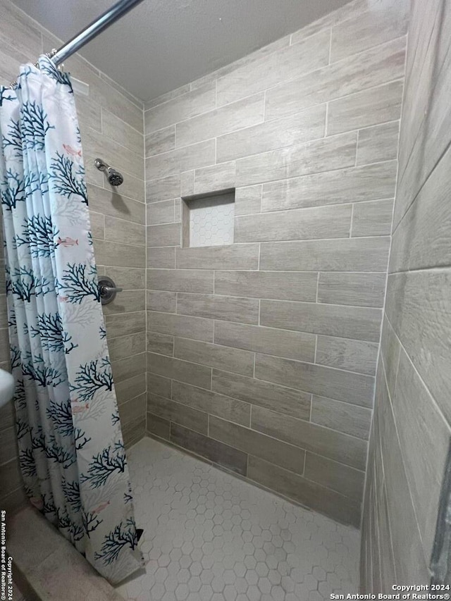 bathroom with a stall shower