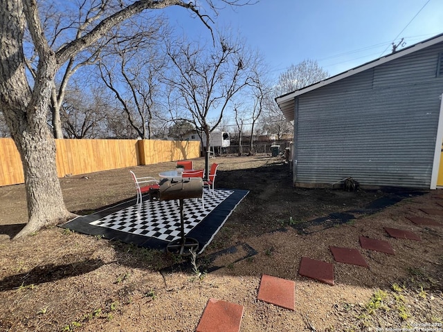 view of yard with a fenced backyard and a patio area