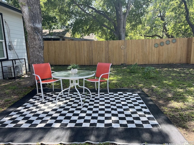 view of patio featuring a fenced backyard and ac unit